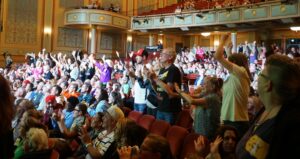Strand Theatre audience on their feet and cheering