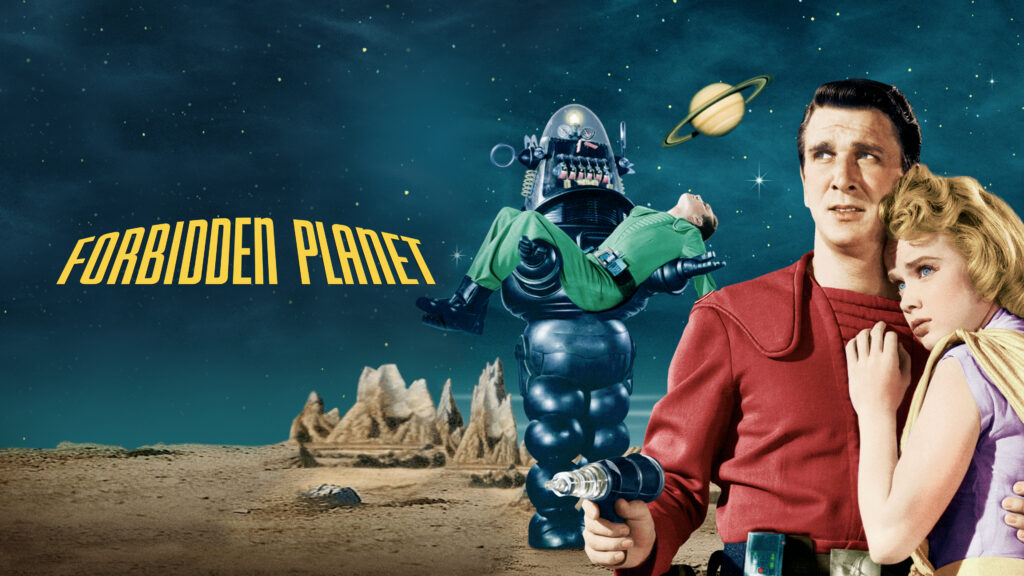 Title poster for the movie Forbidden Planet, featuring a man and woman holding each other and a giant robot behind them carrying a man laying in his arms and a starry sky behind them