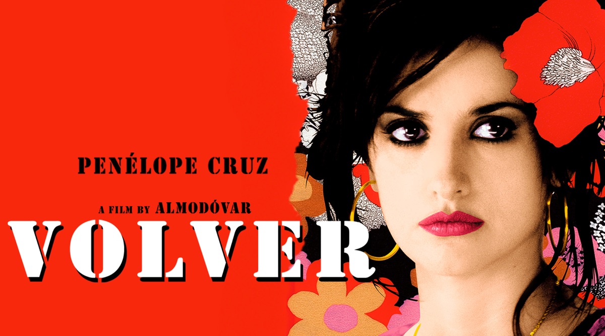 Movie poster for Volver, featuring Penelope Cruz with smokey makeup and red lipstick with a messy updo and red flower in her hair