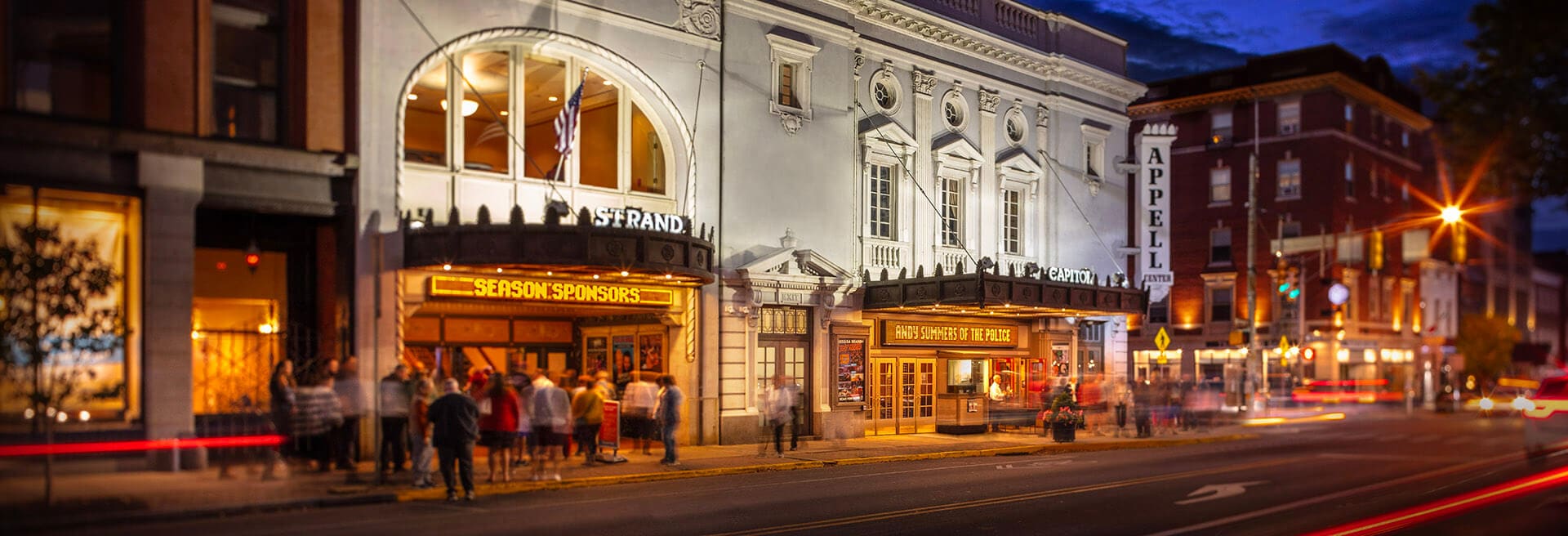 photo of the Appell Center exterior taken across the street with fans gathering for a show