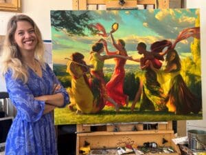 Artist Adrienne Stein standing alongside her original painting "Dancing Muses" in her studio