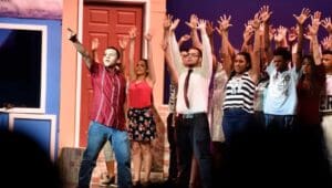 Augustine Mariche (left) in the 2016 William Penn High School production of In tThe Heights on the Strand Theatre stage.