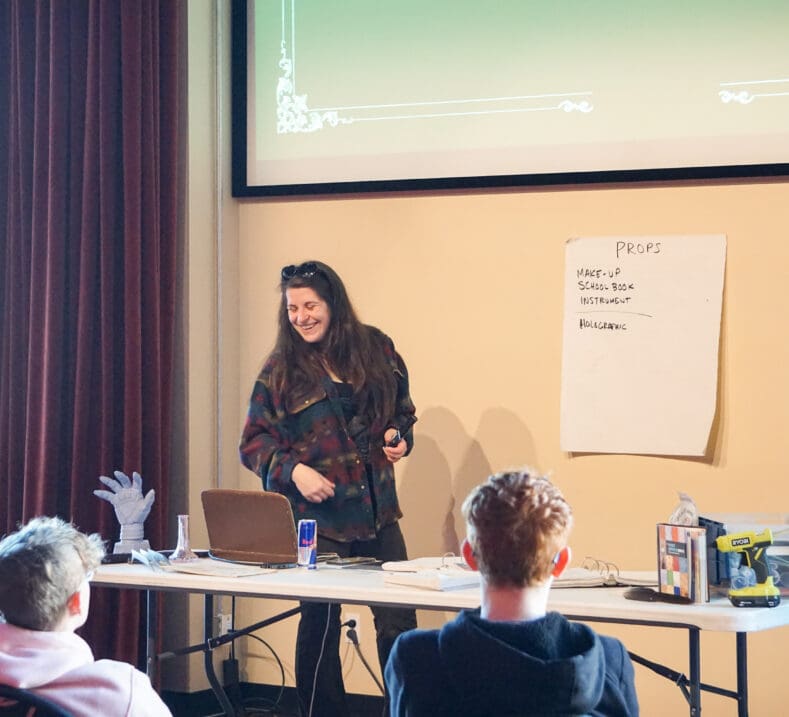 A teacher in front of a small class