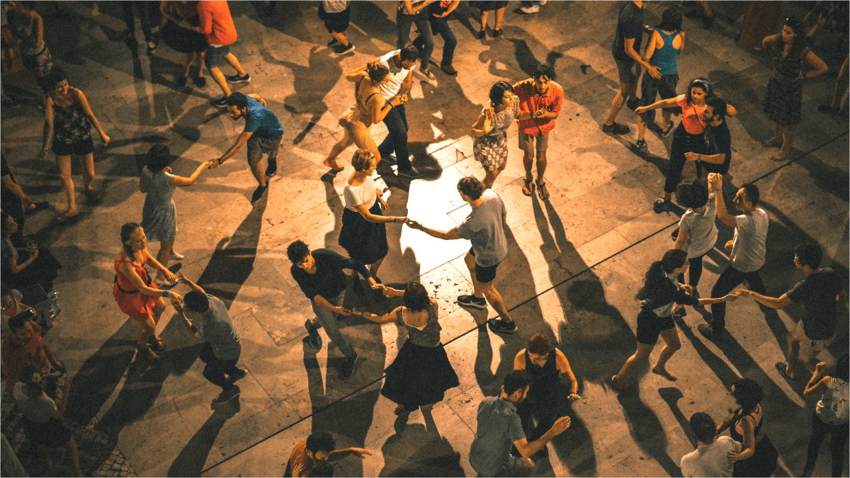 Large group of young people dancing as seen from above