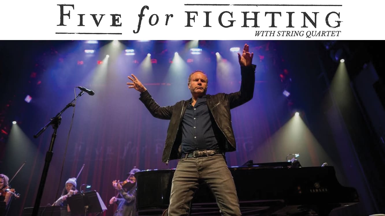 photo of Five For Fighting on stage with band logo at the top