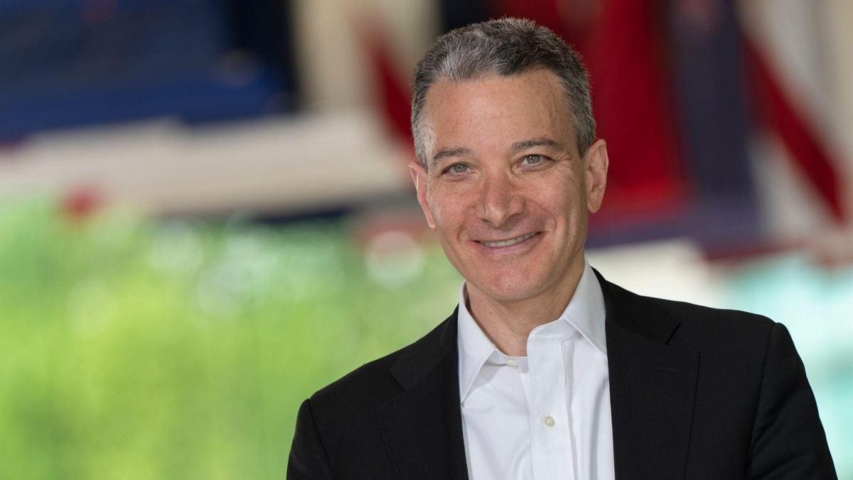 portrait photo of Jeffrey Rosen wearing a white button down shirt and black suit jacket