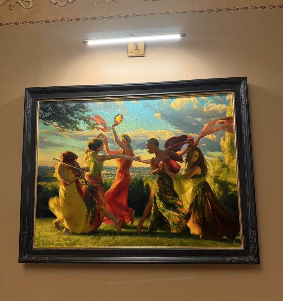 "Dancing Muses" painting by Adrienne Stein hangin in the Strand Theatre lobby