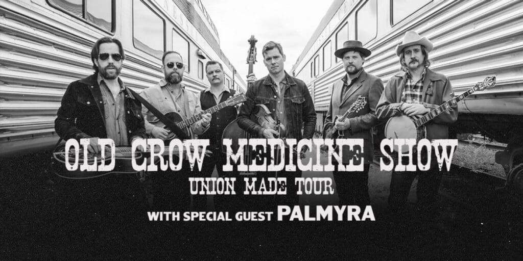 black and white photo of the band Old Crow Medicine Show with name and tour title at the bottom in white