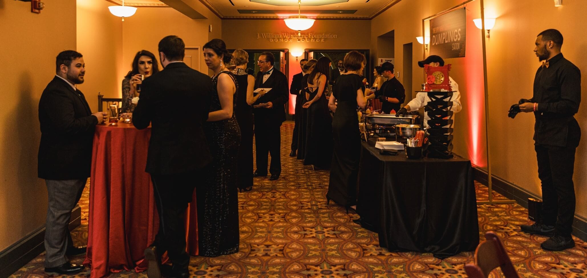 formal gathering in Strand Theatre upper lobby