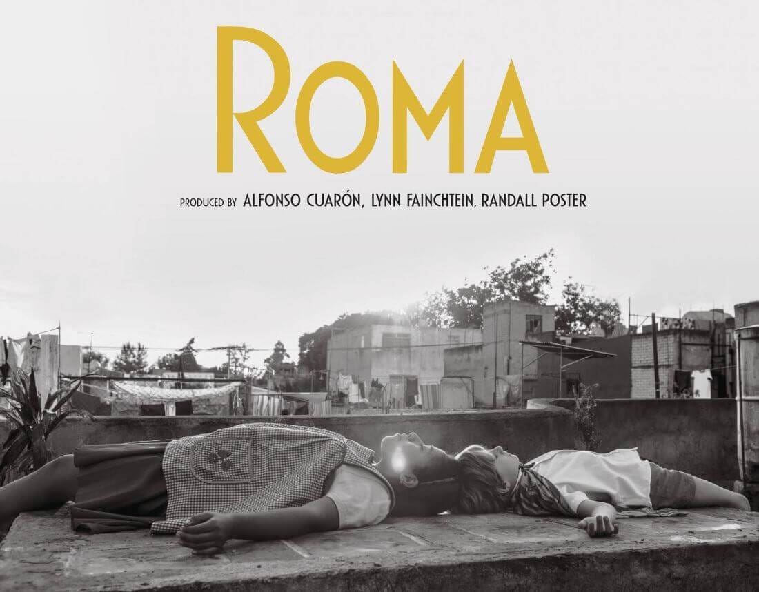 Roma title image with kinds laying on the ground staring up at the sky