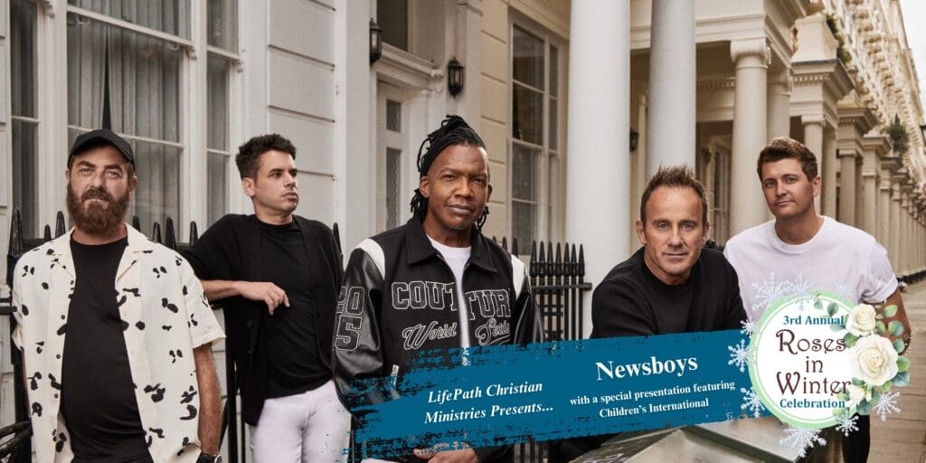 5 members of Newsboys walking down city street