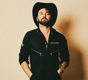 Shake Graveys in black wearing black cowboy hat