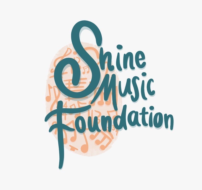 Shine Music Foundation logo with teal letterng against peach colored music notes and symbols