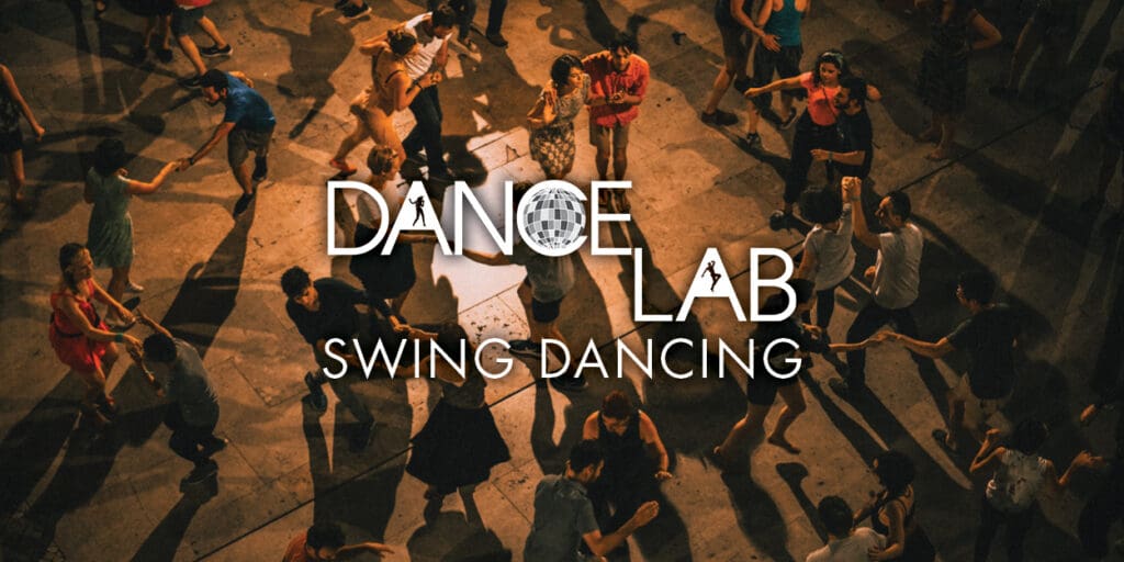 Photo of a crowd of people swing dancing for Dance Lab