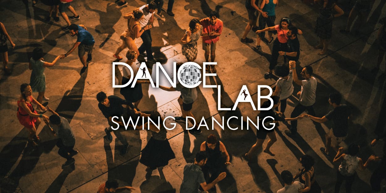 Photo of a crowd of people swing dancing for Dance Lab