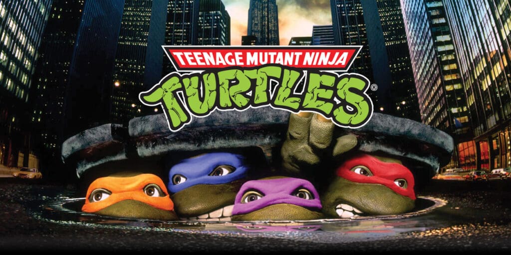 Movie poster for Teenage Mutant Ninja Turtles with all 4 guys peeking out of street manhole cover