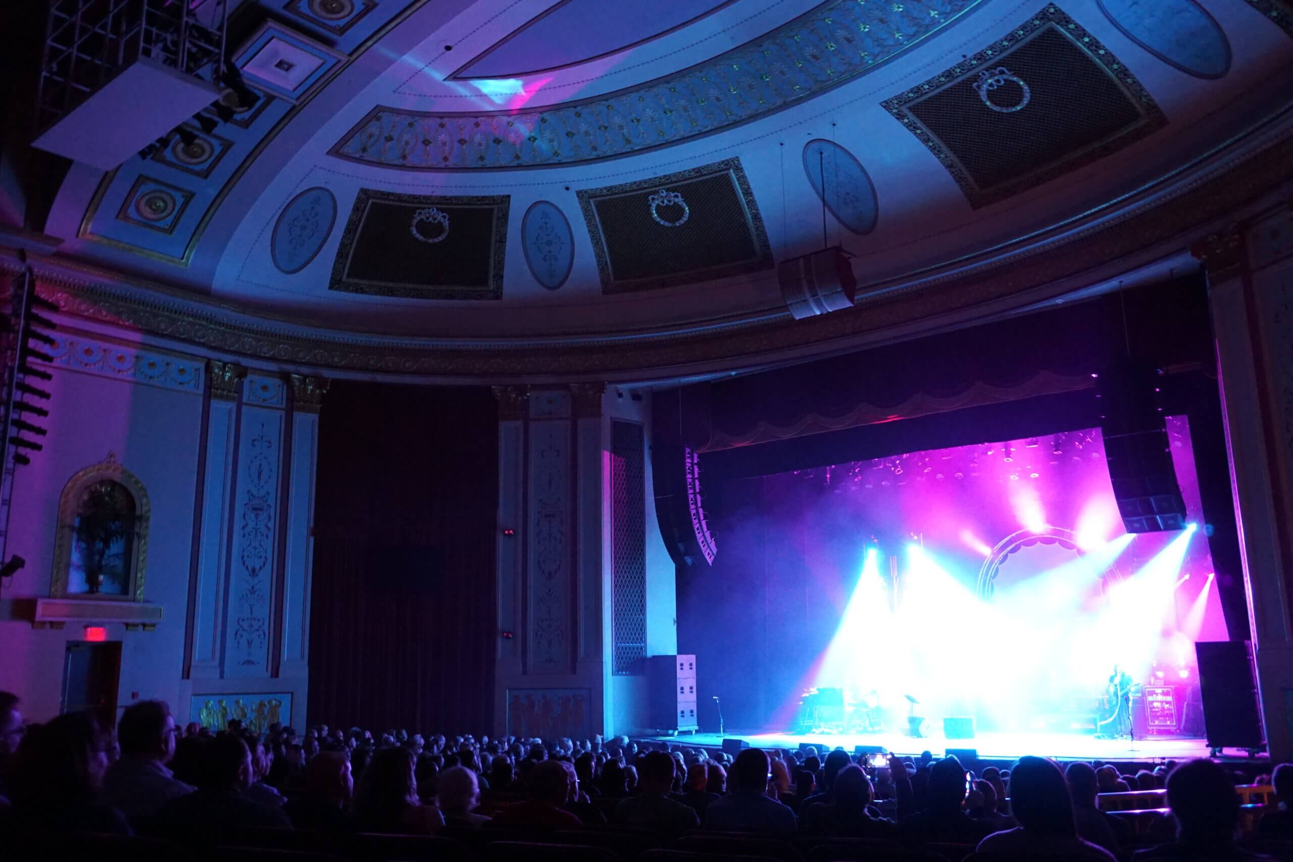 Strand Theatre Audience with spotlights on stage