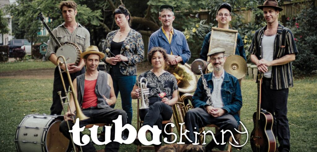 Members of the band Tuba Skinny posing outdoors with their instruments