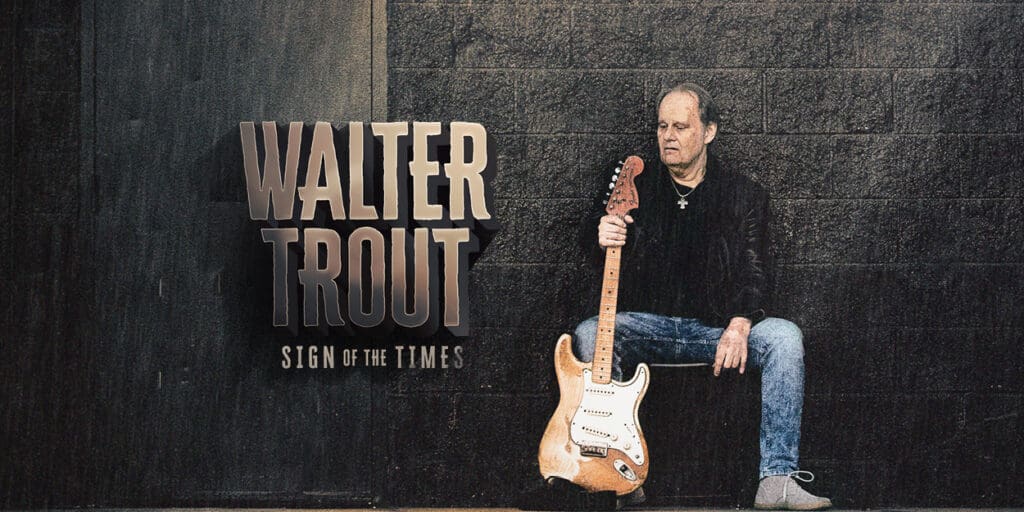 Walter Trout seated with gutar againts his leg with his name and show title in gold on the left