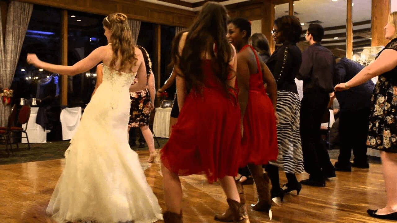 people dancing at a wedding