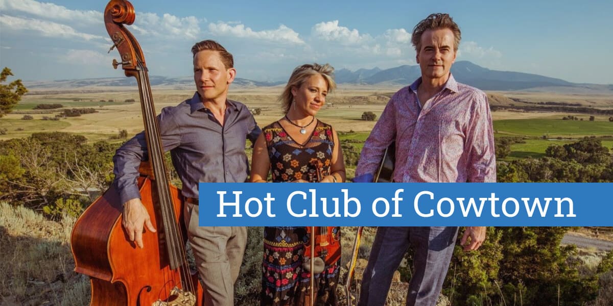 members of Hot Club of Cowtown with their instruments with a landscape in the background