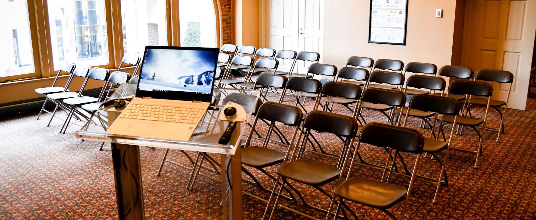 The Appell Center's donor lounge set up with rows of chairs for a presentation.