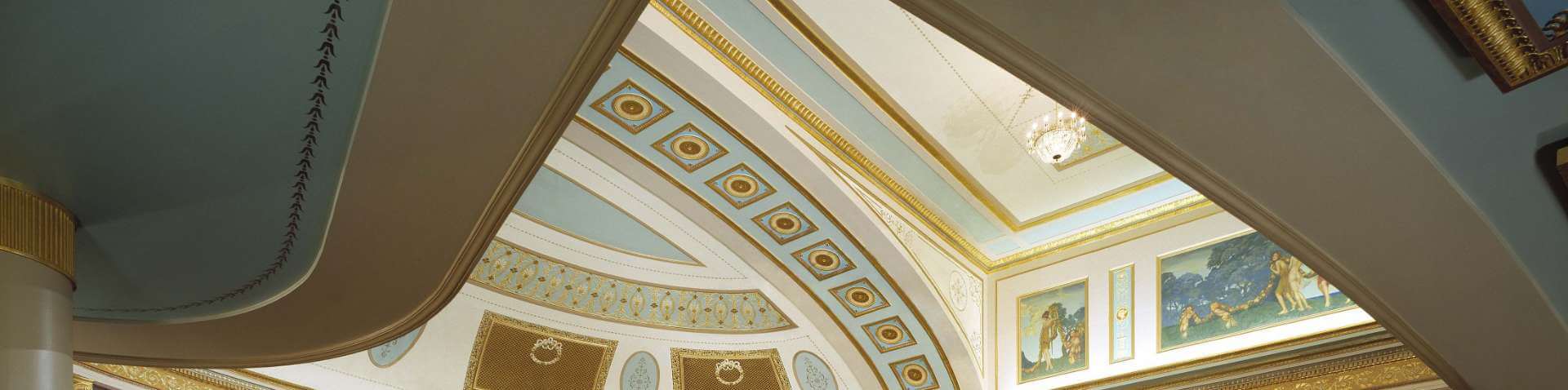 Photograph of the intricate ceiling of the Strand Theatre from under the left balcony section.